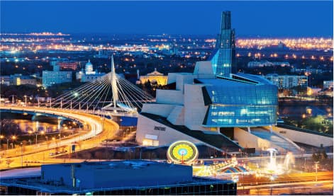 Winnipeg's vibrant cityscape glows at night, highlighting bustling urban center with vibrant lights and architecture, symbolizing the secured urban living with tenant insurance
