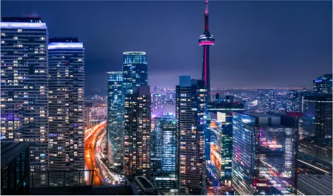 Toronto skyline at night with CN Tower, symbolizing urban living protected by Ontario tenant insurance