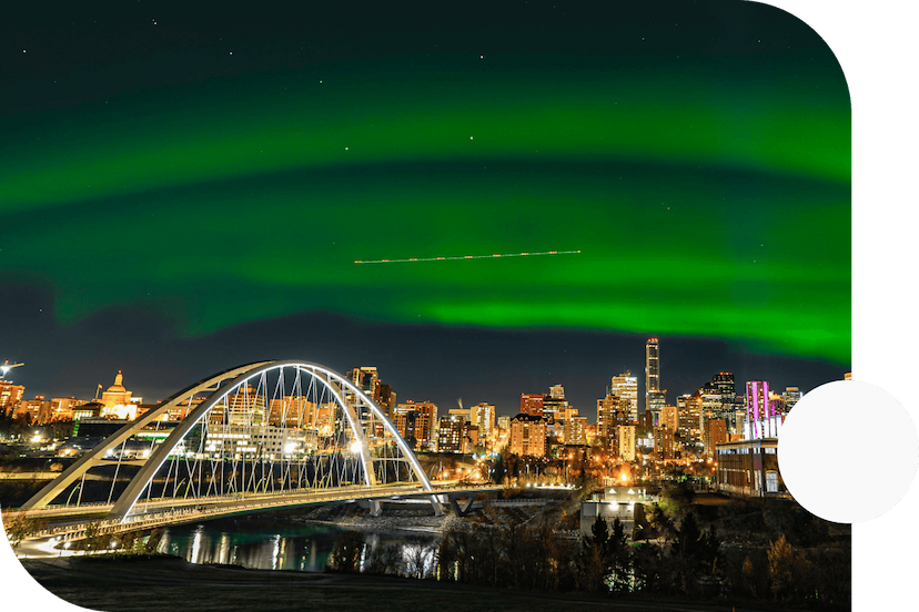 Northern-Lights-shining-over-Downtown-Edmonton-at-night-from-across-the-North-Saskatchewan-river-with-a-view-of-the-Walterdale-Bridge